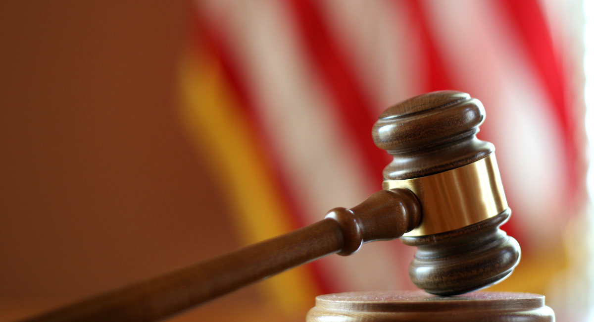 Gavel with American flag in background