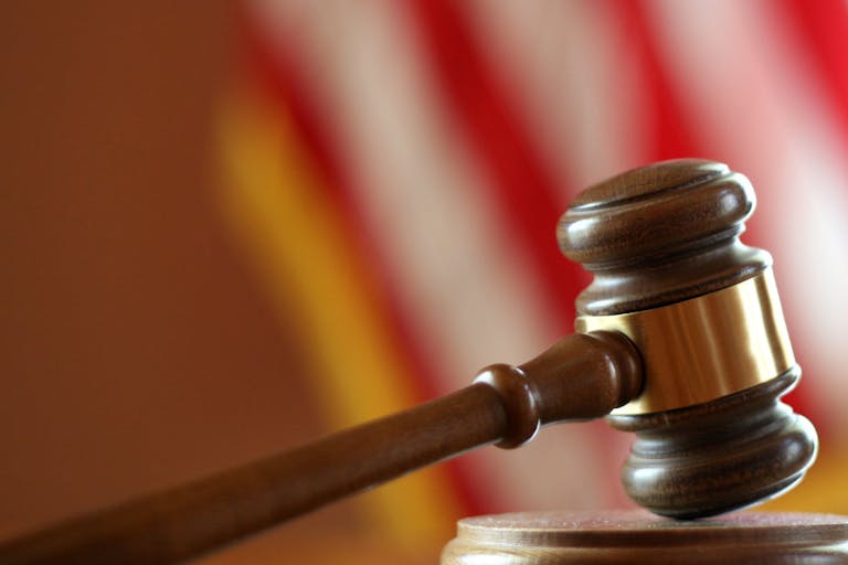 Photo: ftwitty/Getty Images Gavel with American flag in background