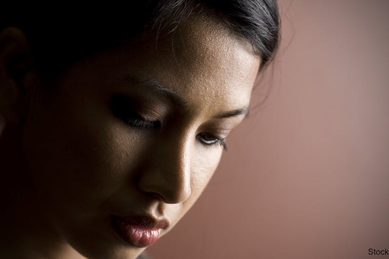 Asian Woman Looking Down