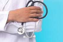 male doctor holding a stethoscope