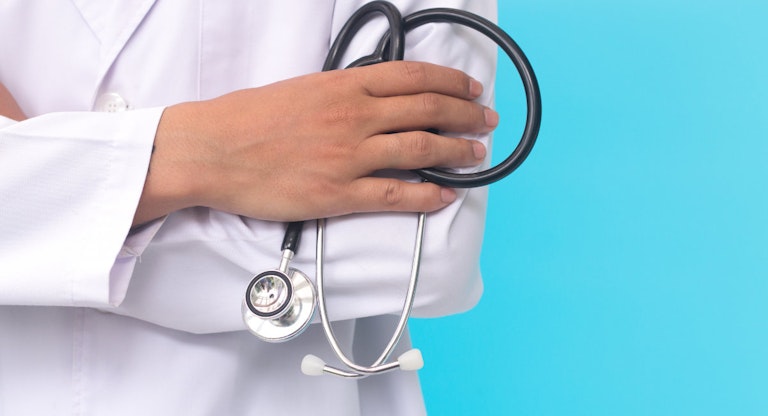 male doctor holding a stethoscope