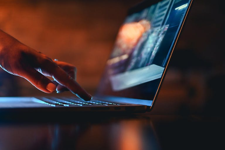 hand typing on computer keyboard