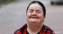 Woman with down syndrome smiling