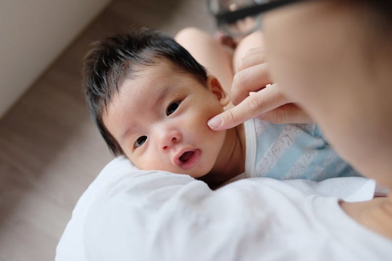 Asian mother comforting baby