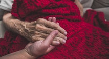 Hospice Nurse visiting an elderly male patient