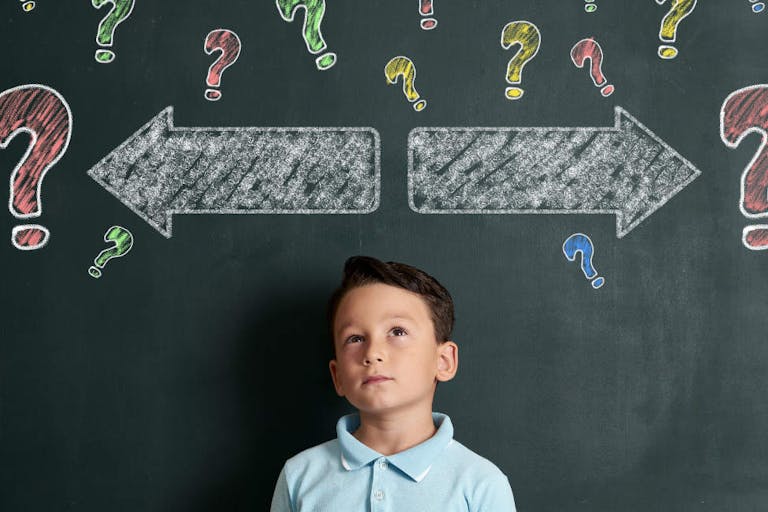 6-7 years elementary age child thinking solution for decide