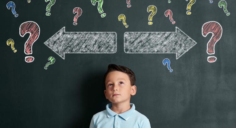 6-7 years elementary age child thinking solution for decide