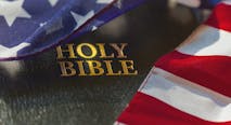 American flag draped over bible