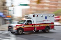 Photo: B&M Noskowski/MACIEJ NOSKOWSKI (Getty Images) Blurred image of an ambulance on a city street