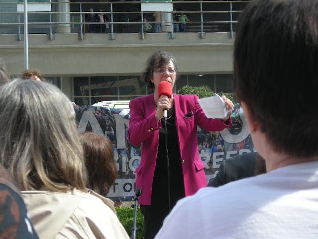 Dr. Monica Miller speaks to a crowd. Dr. Monica Miller speaks to a crowd.