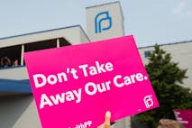 Photo: SAUL LOEB/AFP/Getty Images Planned Parenthood sign reads, 'Don't Take Away Our Care', Pro-choice supporters and staff of Planned Parenthood hold a rally outside the Planned Parenthood Reproductive Health Services Center in St. Louis, Missouri, May 31, 2019, the last location in the state performing abortions, after a US Court announced the clinic could continue operating. - A US Court on May 31, 2019 blocked Missouri from closing the clinic.