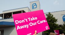 Planned Parenthood sign reads, 'Don't Take Away Our Care', Pro-choice supporters and staff of Planned Parenthood hold a rally outside the Planned Parenthood Reproductive Health Services Center in St. Louis, Missouri, May 31, 2019, the last location in the state performing abortions, after a US Court announced the clinic could continue operating. - A US Court on May 31, 2019 blocked Missouri from closing the clinic.