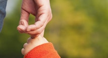Child holding mothers hand