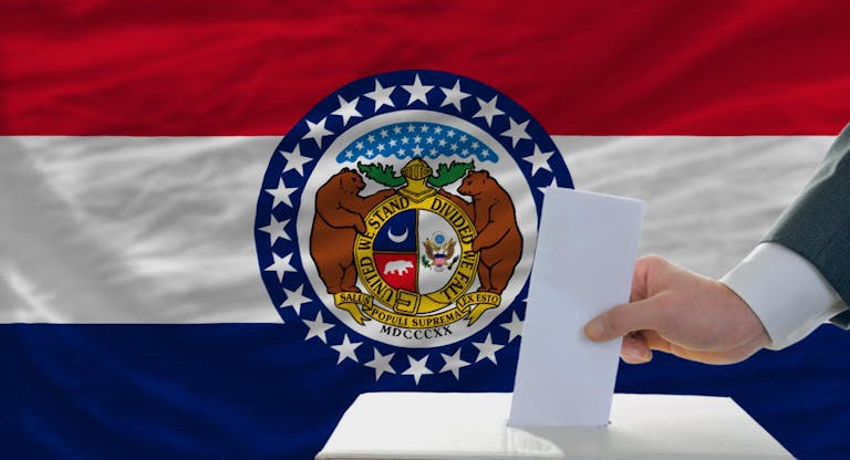 elections voting in front of flag of missouri