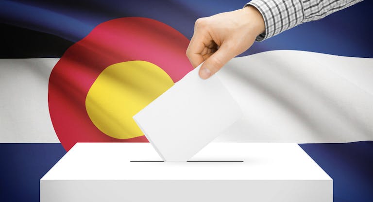 Ballot box with national flag on background – Colorado