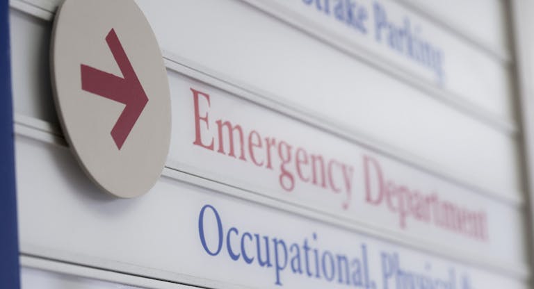 Close up of sign for emergency department in hospital