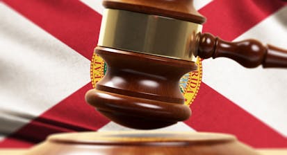 Wood Gavel Standing Front Of the Florida State Flag Closeup 3d Render