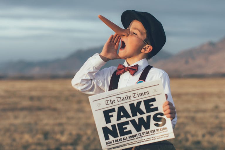 Old Fashioned Pinocchio News Boy Holding Fake Newspaper