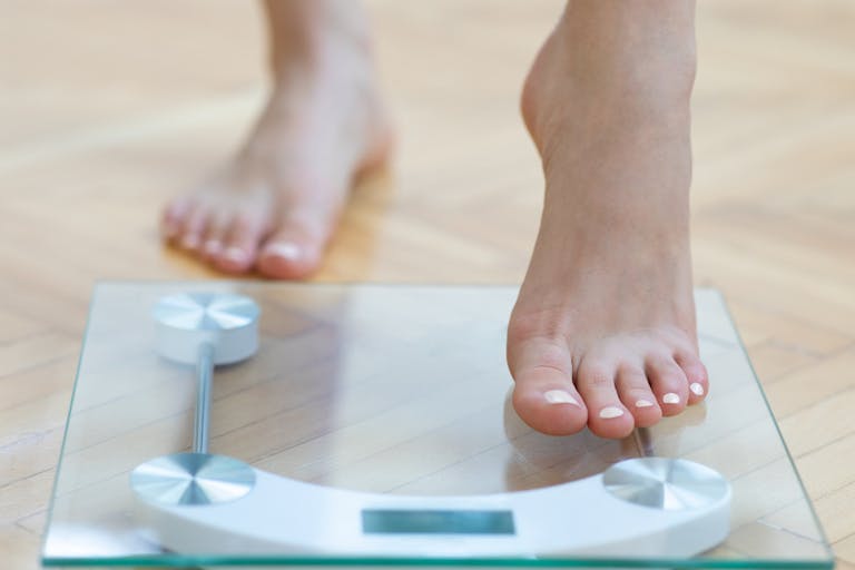 Female feet weighing scale