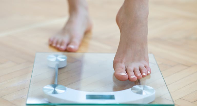 Female feet weighing scale