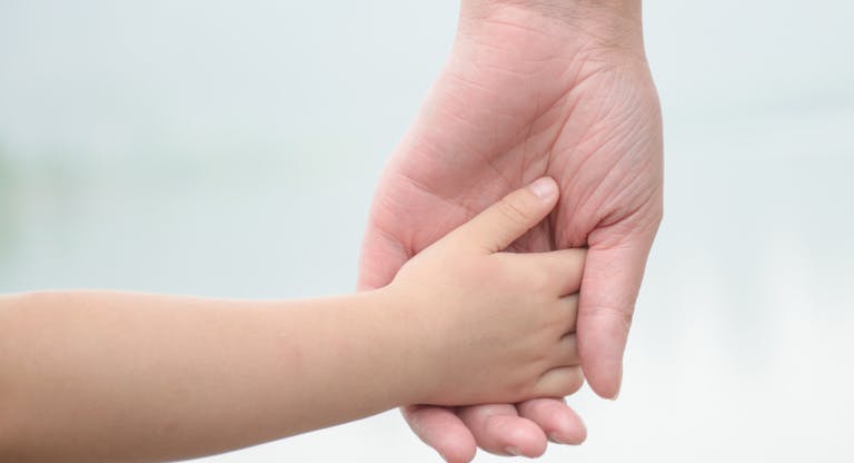 hand in hand,small hand in big hand