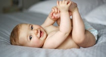 7 month old baby on bed