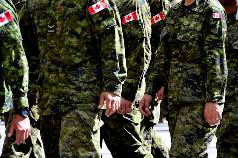 Canadian Soldeiers in Camo Marching