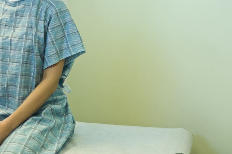 Patient waiting on examination table