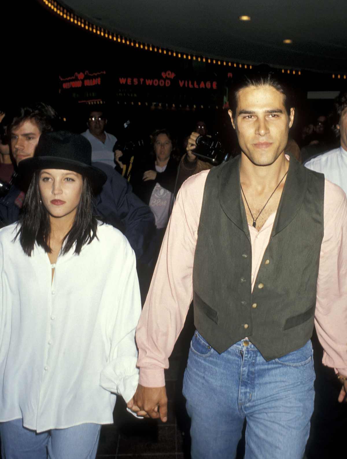 WESTWOOD, CA – JUNE 13: Lisa Marie Presley and husband Danny Keough attend the “The Naked Gun 2½: The Smell of Fear” Westwood Premiere on June 13, 1991 at Mann Bruin Theatre in Westwood, California. (Photo by Ron Galella, Ltd./Ron Galella Collection via Getty Images)