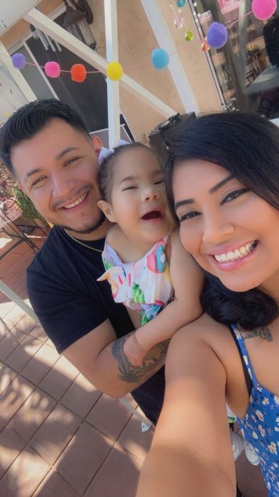 Rebecca wth her partner and their daughter Aaliyah.