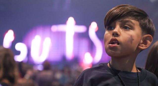 Palm Desert, CA – February 23: Izalco Martinez, 9, looks on as he waits alongside others during the opening night of Olivia Rodrigo’s ‘Guts’ tour at Acrisure Arena on Friday, Feb. 23, 2024 in Palm Desert, CA. (Photo by Michael Blackshire/Los Angeles Times via Getty Images) Palm Desert, CA – February 23: Izalco Martinez, 9, looks on as he waits alongside others during the opening night of Olivia Rodrigo’s ‘Guts’ tour at Acrisure Arena on Friday, Feb. 23, 2024 in Palm Desert, CA. (Photo by Michael Blackshire/Los Angeles Times via Getty Images)