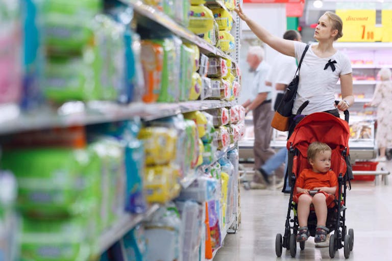 Mother with her boy in the supermarket