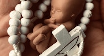 Fetus with rosary