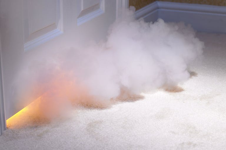 Smoke coming in under door