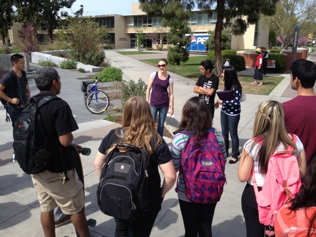 Gabi (in the purple) preaches. gabi preaches