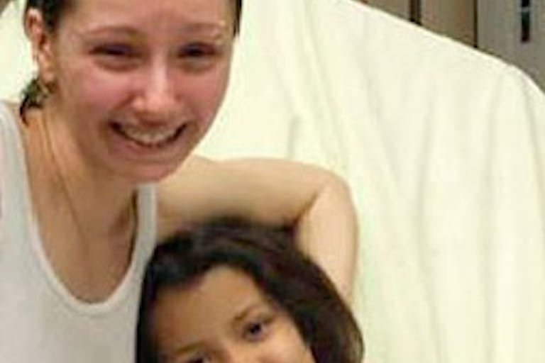 Amanda Berry (centre) is reunited with her sister in Cleveland, Ohio