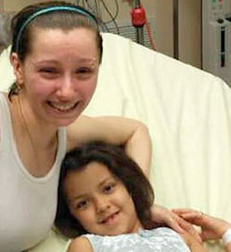 Amanda Berry (centre) is reunited with her sister in Cleveland, Ohio
