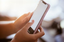 teenage girl using smart phone in her home