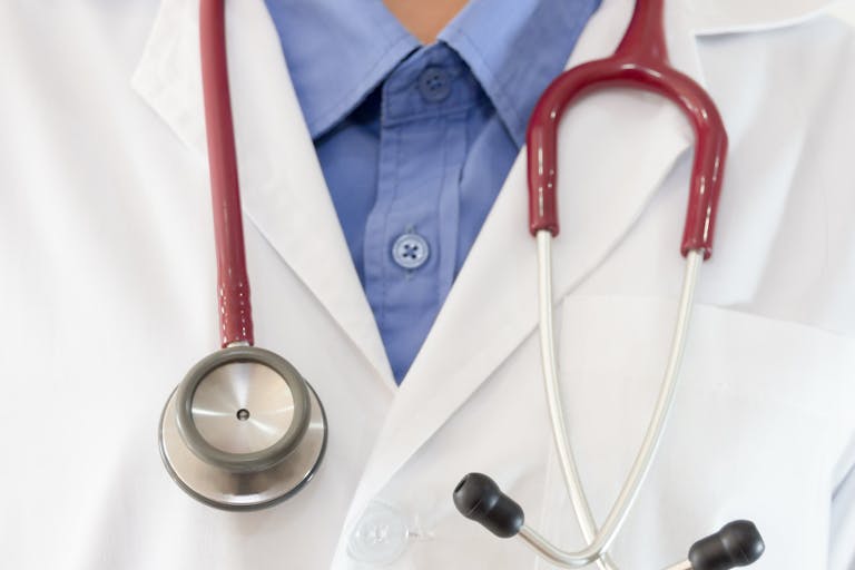 Midsection Of Female Doctor With Stethoscope