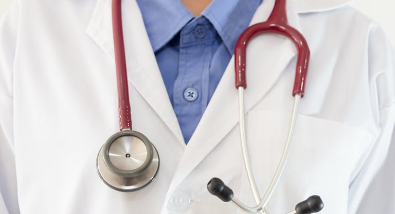 Midsection Of Female Doctor With Stethoscope