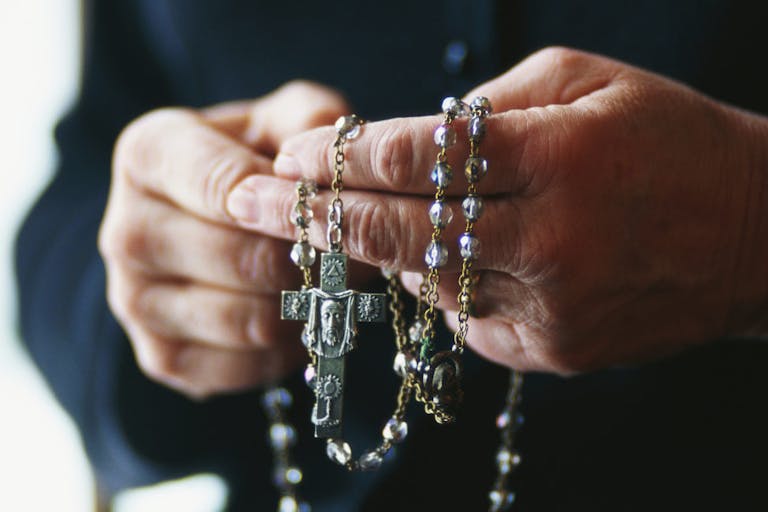 Praying with Rosary Beads