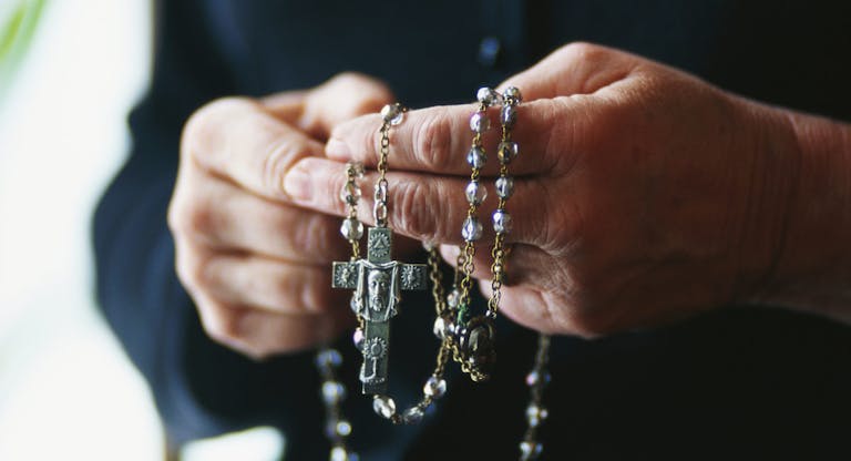 Praying with Rosary Beads