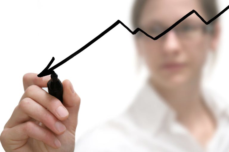 businesswoman drawing graph