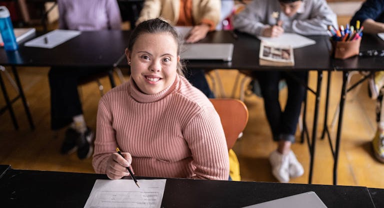 Portrait of a young woman with special needs in the classroom