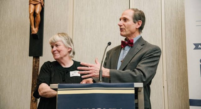 Joan and Chris Bell at podium (Photo courtesy of Chris Bell)