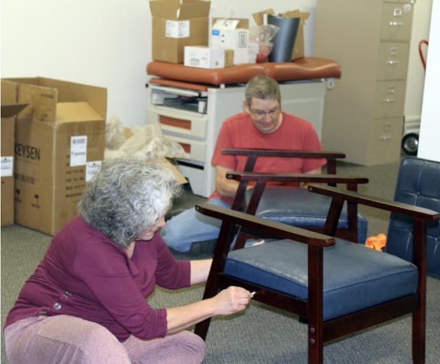 Volunteers Encarnita Olson (left) and husband Jim assemble chairs at the soon-to-open second True Care location. ©Gayle Irwin pregnancy center, abortion