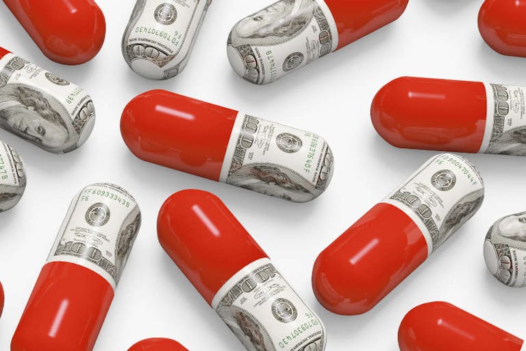 Pills decorated with dollar bills