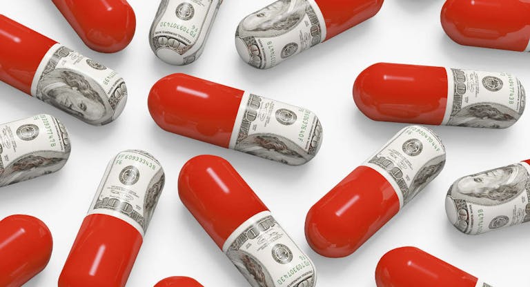 Pills decorated with dollar bills