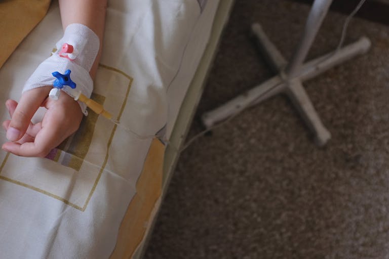 Child’s hand with IV drip attached