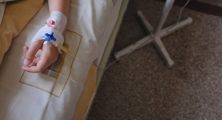 Child’s hand with IV drip attached